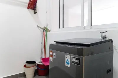 a water tank in a bathroom with a sink at TR Residence Lovely 3 BR unit 6pax next to Titiwangsa LRT in Kuala Lumpur