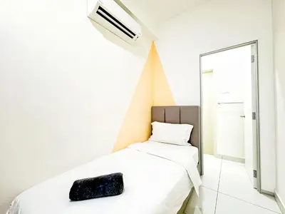 a white bedroom with a bed and a mirror at Arte Mont Kiara Kuala Lumpur in Kuala Lumpur