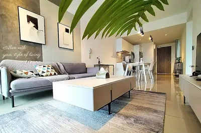 a living room with a couch and a table at Awesome Designer Suite 3-Beds Near TRX KLCC, Next to IKEA in Kuala Lumpur