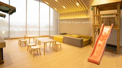 a room with a loft bed and tables and a slide at Awesome Designer Suite 3-Beds Near TRX KLCC, Next to IKEA in Kuala Lumpur