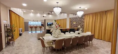 a dining room with a long table and chairs at Bukit Tunku KLCC Grande Villa 11 by Vale Pine in Kuala Lumpur