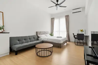 a living room with a couch and a table at Una serviced Apartment in Kuala Lumpur