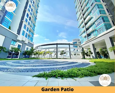 a view of a garden path between two buildings at Pacific Home Petaling Jaya by Seven Sins in Petaling Jaya
