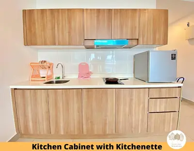 a kitchen with a kitchen cabinet with kitchen furniture at Pacific Home Petaling Jaya by Seven Sins in Petaling Jaya
