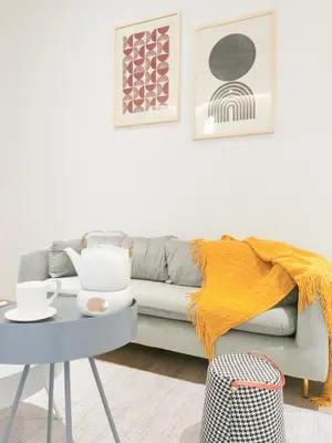 a living room with a couch and a table at The President - Bangsar South Mid Valley in Kuala Lumpur