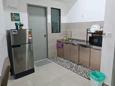 a kitchen with a refrigerator and a sink at Dsistyle Islamic House in Kuala Lumpur