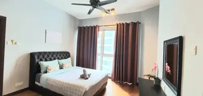 a bedroom with a bed with a cat toy on it at Regalia Suites KLCC View Rooftop Infinity Pool by SHI in Kuala Lumpur