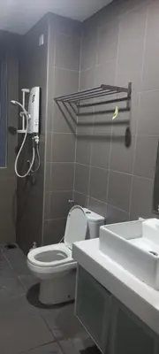 a bathroom with a toilet and a sink and a phone at ESTELAR Apartments at Mercu Summer KLCC in Kuala Lumpur