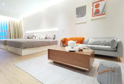 a living room with a bed and a couch at The Toorak @ Bangsar South Mid Valley in Kuala Lumpur