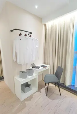a white desk and a chair in a room at The Toorak @ Bangsar South Mid Valley in Kuala Lumpur