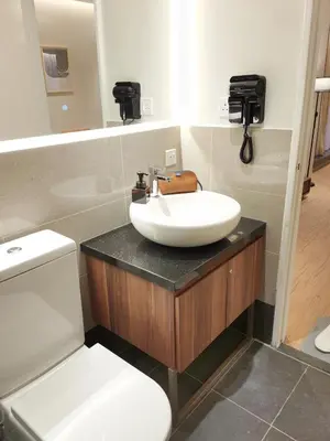 a bathroom with a sink and a toilet at The Toorak @ Bangsar South Mid Valley in Kuala Lumpur