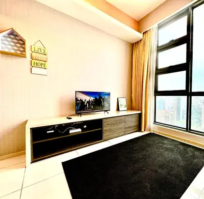a living room with a tv and a large window at The Robertson 2B at Bukit Bintang with Netflix,trx,klcc,pavilion,lalaport in Kuala Lumpur