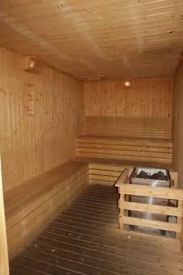 a empty wooden sauna with a bench in it at MyCrib45*The Robertson KL-B.Bintang in Kuala Lumpur