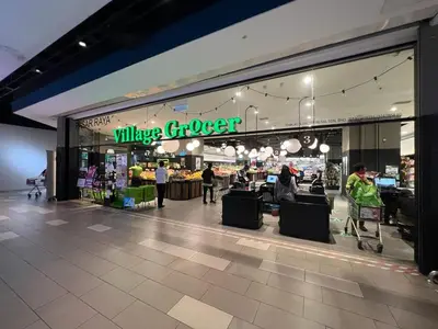 a large grocery store with people walking in front of it at Connected train 3 Bedrooms - ABOVE KLGATEWAY MALL 14 in Kuala Lumpur
