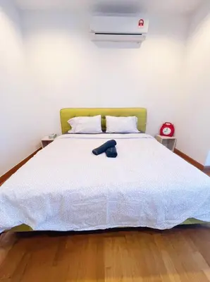 a bedroom with a bed with a hat on it at Connected train 1 Bedroom ABOVE MALL-16 in Kuala Lumpur