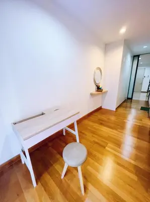 a white room with a bench and a stool at Connected train 1 Bedroom ABOVE MALL-16 in Kuala Lumpur