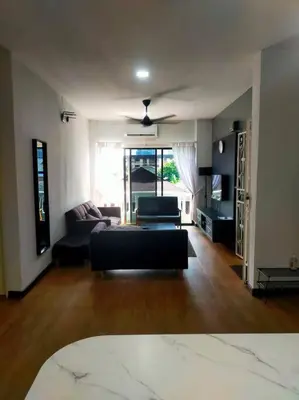 a living room with a couch and a table at Omar's place 4 - Best view of KLCC Twin Towers. in Kuala Lumpur