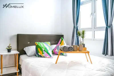 a bedroom with a bed with a table on it at TR Residence WTC Titiwangsa Monorail MRT Station KLCC HKL IJM Bukit Bintang in Kuala Lumpur