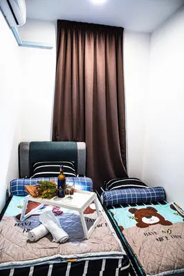 a room with two beds and a table on it at TR Residence WTC Titiwangsa Monorail MRT Station KLCC HKL IJM Bukit Bintang in Kuala Lumpur