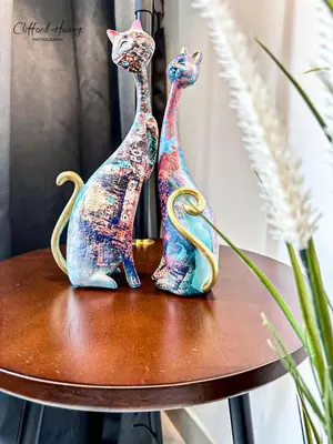 two figurines of two cats sitting on a table at TR Residence WTC Titiwangsa Monorail MRT Station KLCC HKL IJM Bukit Bintang in Kuala Lumpur