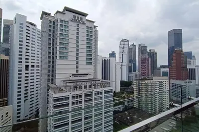 a view of a city skyline with tall buildings at A05 Bukit Ceylon KL Tower View Balcony Apartment in Kuala Lumpur