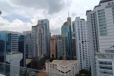 a view of a large city with tall buildings at A05 Bukit Ceylon KL Tower View Balcony Apartment in Kuala Lumpur