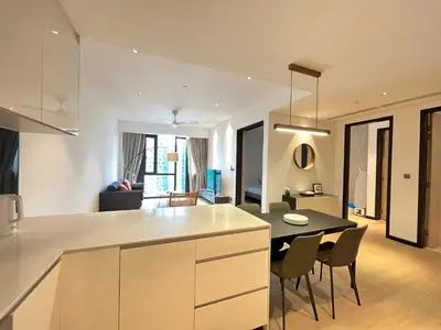 a kitchen and living room with a table and chairs at Atmoods - Star Residence in Kuala Lumpur