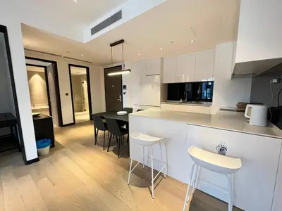 a kitchen and dining room with a table and chairs at Atmoods - Star Residence in Kuala Lumpur