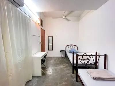 a room with two beds and a sink in it at Tiong Nam 32, Heart of Kuala Lumpur, 15mins to KLCC, 6 mins to LRT PWTC in Kuala Lumpur