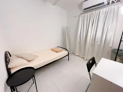 a hospital room with a bed and two chairs at Tiong Nam 32, Heart of Kuala Lumpur, 15mins to KLCC, 6 mins to LRT PWTC in Kuala Lumpur