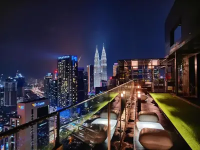 a view of a city skyline at night at Majestic Apartment KLCC in Kuala Lumpur