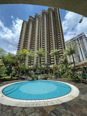 a swimming pool in front of two tall buildings at Charming apartment with Netflix at PWTC in Kuala Lumpur