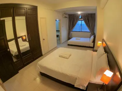 a bedroom with a large white bed and a window at Bukit Bintang Fahrenheit88 Apartment by Sarah's Lodge in Kuala Lumpur