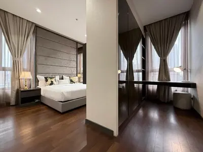 a bedroom with a bed and a large window at 8 Kia Peng Residences by Times 8 in Kuala Lumpur
