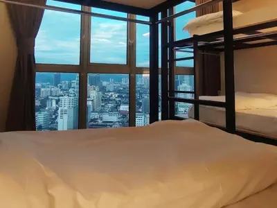 a bedroom with bunk beds and a view of the city at La Vista @ Regalia Residence in Kuala Lumpur