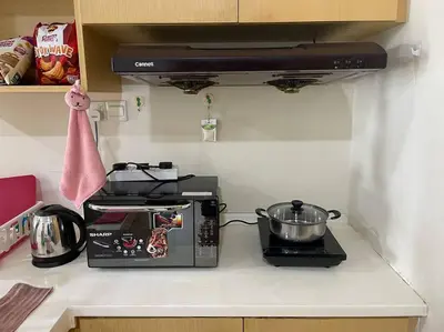 a kitchen counter with a toaster and a pot at Romantic Suite with Private Jacuzzi 176 in Kuala Lumpur