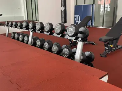 a row of dumbbells in a gym at Romantic Suite with Private Jacuzzi 176 in Kuala Lumpur