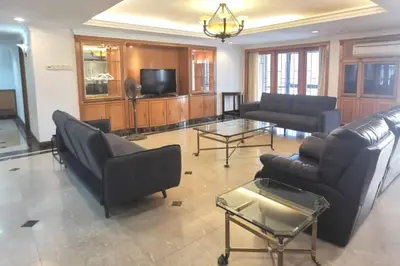 a living room with a couch and a table at Luxurious Spacioushome 17pax Fahrenheit Pavillon in Kuala Lumpur