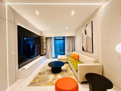 a living room with a couch and a tv at Eaton residences KLCC m@h in Kuala Lumpur