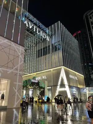 a large building with people walking in front of it at Eaton residences KLCC m@h in Kuala Lumpur