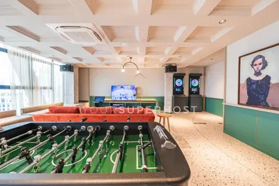 a living room with a large pool table at Scarletz Suites near KLCC by YourSuperhost in Kuala Lumpur