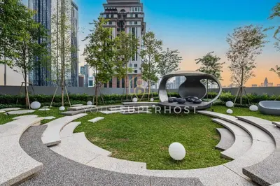 a park with a sculpture in the grass at Scarletz Suites near KLCC by YourSuperhost in Kuala Lumpur