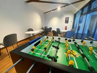 a ping pong table in a room with chairs at PARC 3 in Cheras, #Sunway Velocity #IKEA #TRX in Kuala Lumpur