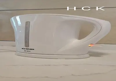 a white toaster sitting on top of a counter at Titiwangsa Core at TR Residence by HCK in Kuala Lumpur