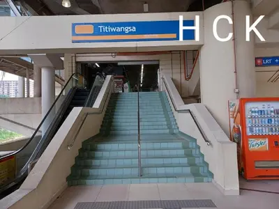 a set of stairs in a building with a sign at Titiwangsa Core at TR Residence by HCK in Kuala Lumpur