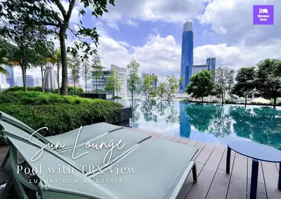 a pool with a view of a city at Continew Residences TRX Lux Pool View in Kuala Lumpur