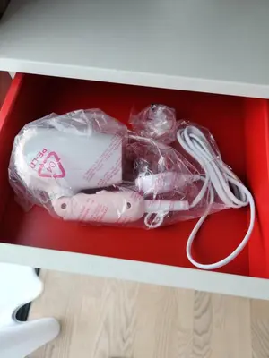 a remote control in a drawer of a desk at Datum Jelatek linked LRT and MALL with Netflix -Disney -WashDryer in Kuala Lumpur