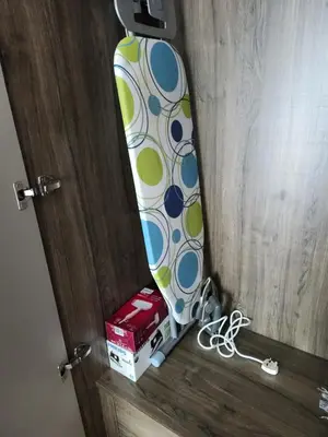 a surfboard sitting on top of a wooden door at Datum Jelatek linked LRT and MALL with Netflix -Disney -WashDryer in Kuala Lumpur