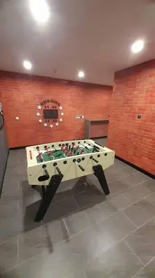 a foosball table in a room with at Datum Jelatek linked LRT and MALL with Netflix -Disney -WashDryer in Kuala Lumpur