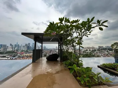 a bench on top of a building overlooking the water at Datum Jelatek linked LRT and MALL with Netflix -Disney -WashDryer in Kuala Lumpur